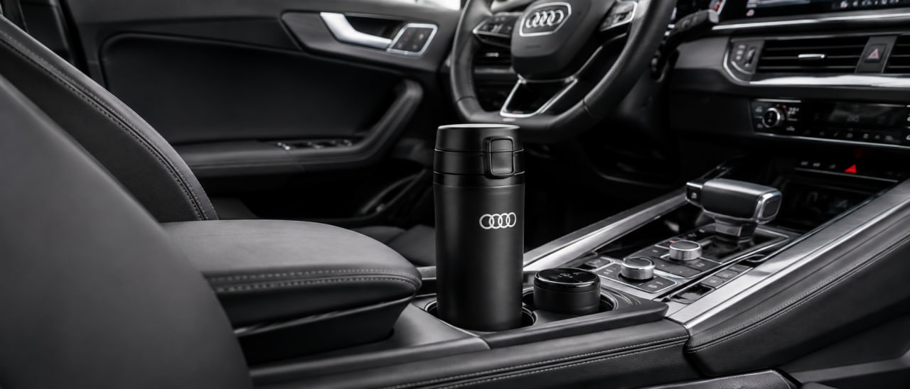 Branded thermos bottle placed in the center console cup holder